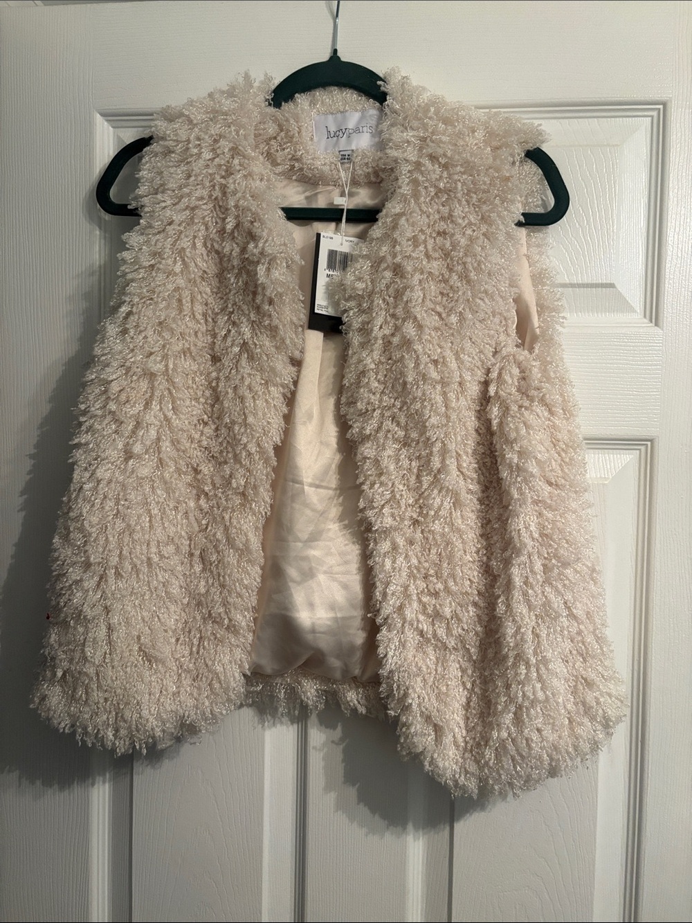 Ivory shaggy faux fur vest—Lucy Paris